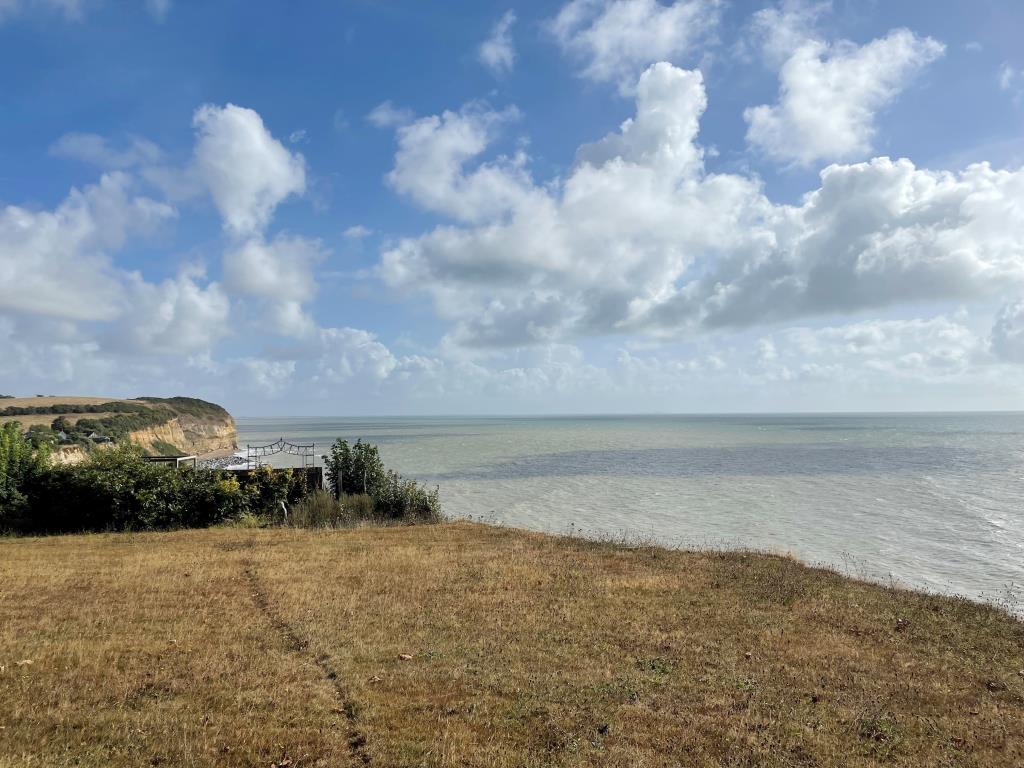 Lot: 37 - CHALET BUNGALOW WITH VIEWS TOWARDS PETT LEVEL AND THE CHANNEL - View of cliff edge towards sea